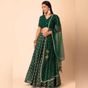 Deep green lehenga set with blouse and dupatta